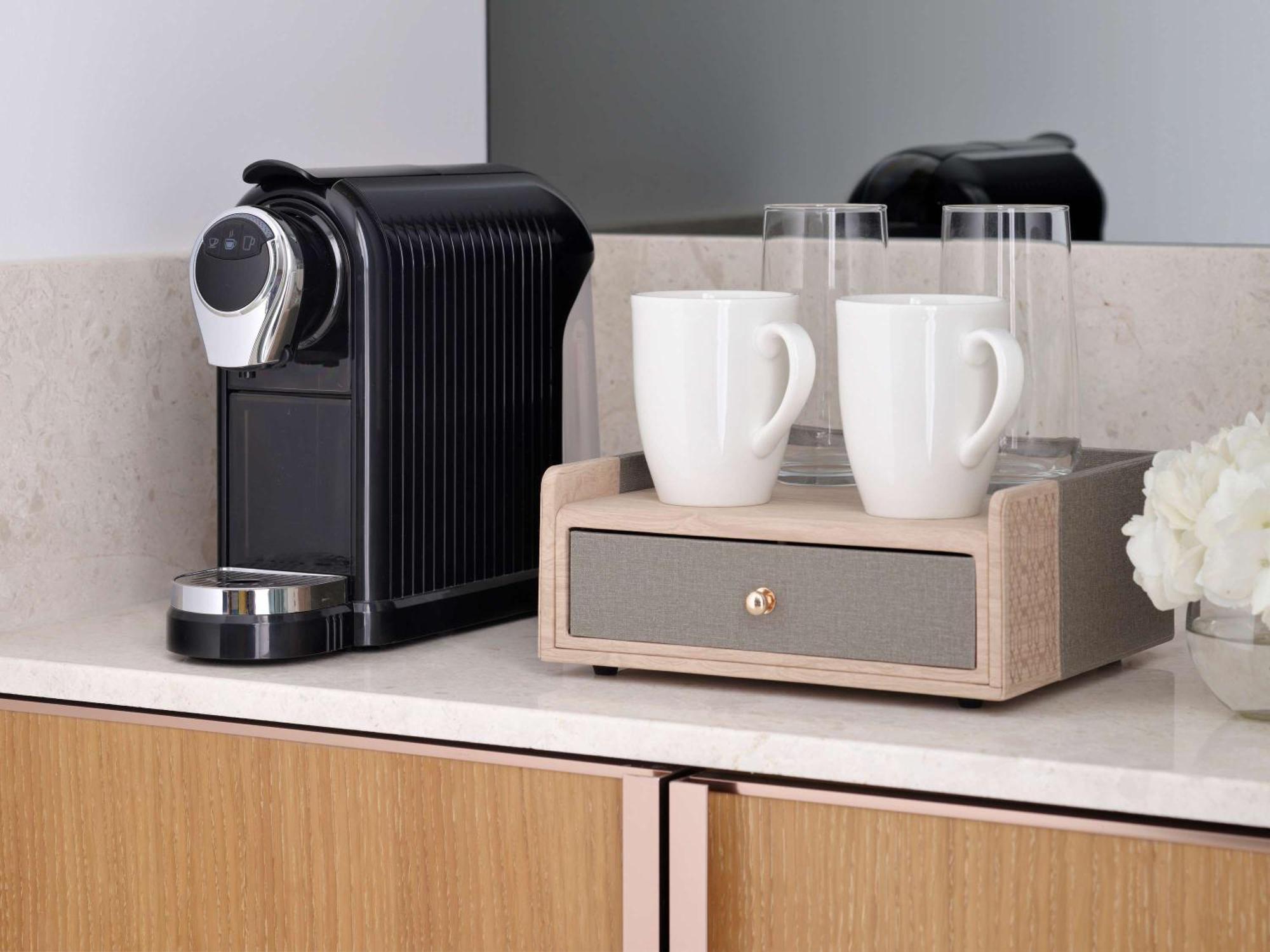 Moevenpick Hotel & Apartments Ghala Muscat Luaran gambar A Nespresso coffee machine