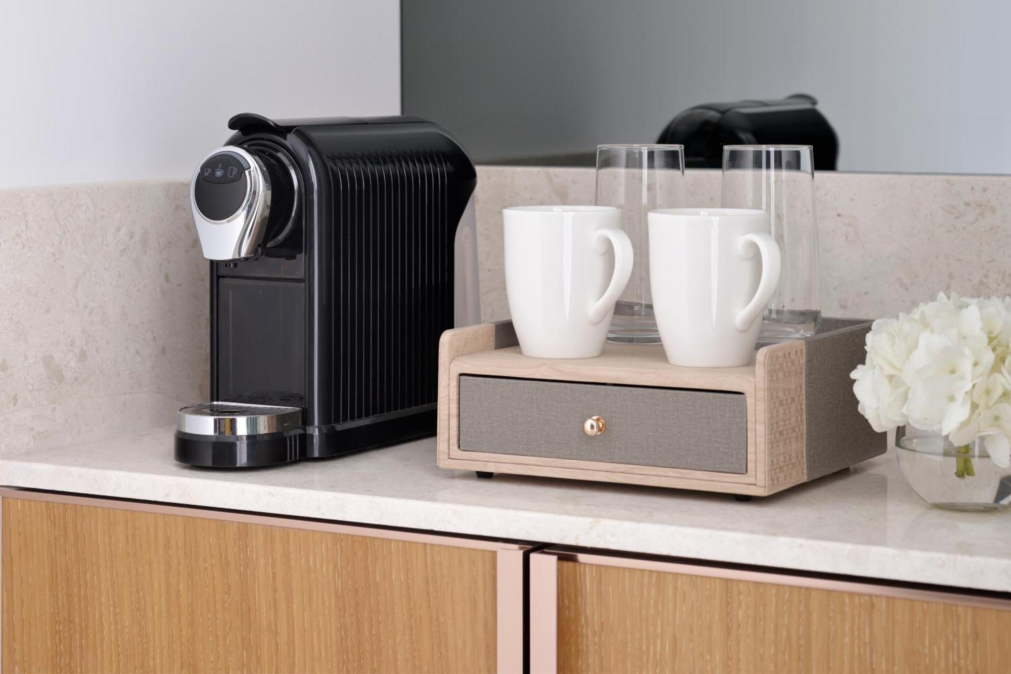 Moevenpick Hotel & Apartments Ghala Muscat Luaran gambar A Nespresso coffee machine